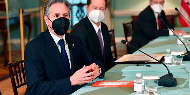 Feb. 4, 2022: Secretary of State Antony Blinken, left, speaks to the media before meeting with Polish Foreign Minister Zbigniew Rau, not shown, at the State Dept. in Washington. (Nicholas Kamm/Pool via AP)