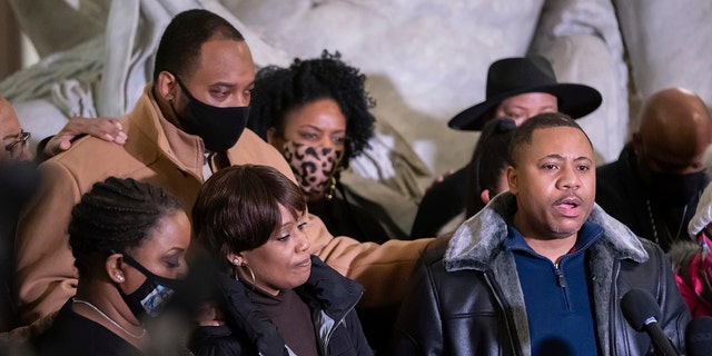 Amir Locke's father Andre Locke speaks at a news conference, with Amir's mother Karen Wells, at left, Friday, Feb. 4, 2022, in Minneapolis. (Associated Press)