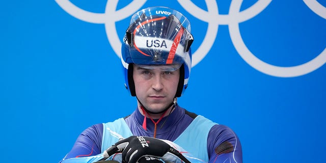 Tucker West, of the United States, prepares to start the luge men's single round 3 at the 2022 Winter Olympics, Sunday, Feb.  6, 2022, in the Yanqing district of Beijing.