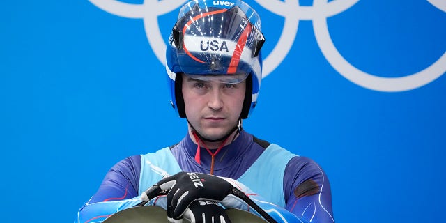 Tucker West, of the United States, prepares to start the luge men's single round 3 at the 2022 Winter Olympics, Sunday, Feb. 6, 2022, in the Yanqing district of Beijing.