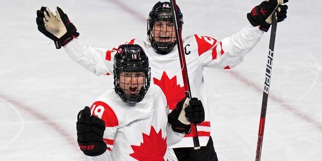 Canada surges to 4-2 win over US in Olympic women's hockey 3 Canada's Brianne Jenner (19) celebrates with Marie-Philip Poulin (29) after Jenner scored a goal against the United States during a preliminary round women's hockey game at the 2022 Winter Olympics, Tuesday, Feb. 8, 2022, in Beijing.