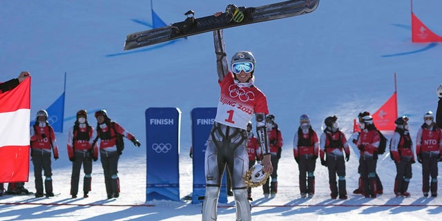 Ester Ledecka defends Olympic snowboard PGS title, ski racing next 3 Gold medalist Czech Republic's Ester Ledecka celebrates during the venue ceremony for the women's parallel giant slalom at the 2022 Winter Olympics, Tuesday, Feb. 8, 2022, in Zhangjiakou, China.