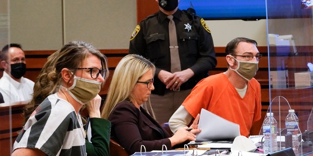 Jennifer Crumbley, left, and James Crumbley, the parents of Ethan Crumbley, appear in court for a preliminary examination on involuntary manslaughter charges in Rochester Hills, Michigan, on Feb. 8, 2022.