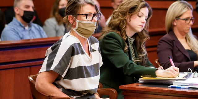 Jennifer Crumbley, mother of Ethan Crumbley, a teenager accused of killing four students in a shooting at Oxford High School, appears in court for a preliminary examination on involuntary manslaughter charges in Rochester Hills, Mich., Feb. 8, 2022. 