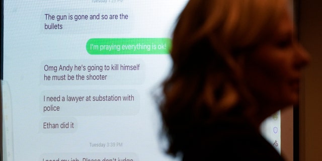 Texts from Jennifer Crumbley, mother of the teenager accused of killing four students in a shooting at Oxford High School, sent to co-worker Andrew Smith are shown. (AP Photo/Paul Sancya)