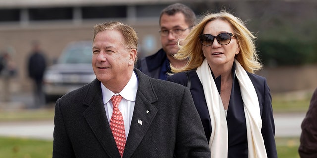 Mark McCloskey, a Republican candidate for the US Senate in Missouri, and his wife, Patricia McCloskey, walk outside the Kenosha County Courthouse, Tuesday, Nov.  16, 2021, in Kenosha, Wisconsin.