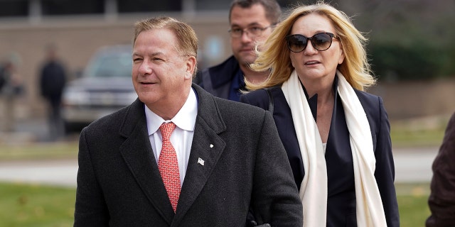 Mark McCloskey, a Republican candidate for U.S. Senate in Missouri, and his wife, Patricia McCloskey, walk outside the Kenosha County Courthouse, Tuesday, Nov. 16, 2021, in Kenosha, Wisconsin.