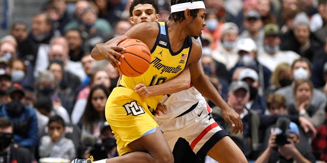 Marquette's Justin Lewis making a rapid rise 3 Marquette's Justin Lewis (10) is guarded by Connecticut's Andre Jackson in the first half of an NCAA college basketball game, Tuesday, Feb. 8, 2022, in Hartford, Conn.