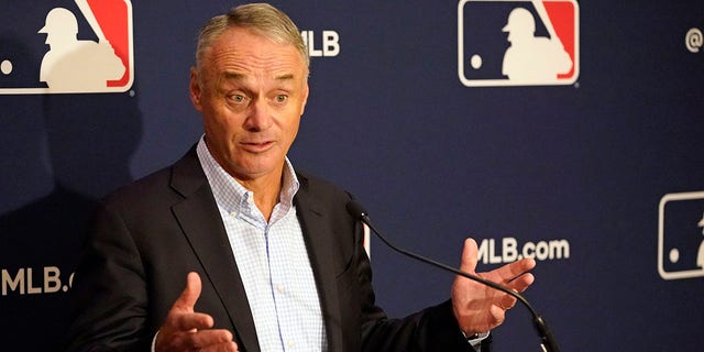 Major League Baseball Commissioner Rob Manfred makes comments during a news conference at the MLB baseball owners meetings Feb. 10, 2022, in Orlando, Fla. 