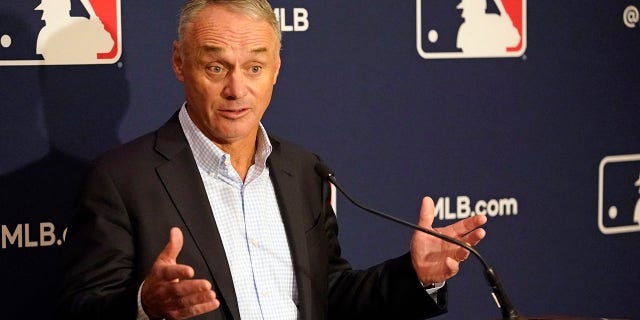 Major League Baseball Commissioner Rob Manfred makes comments during a news conference at the MLB baseball owners meetings Feb. 10, 2022, in Orlando, Fla.