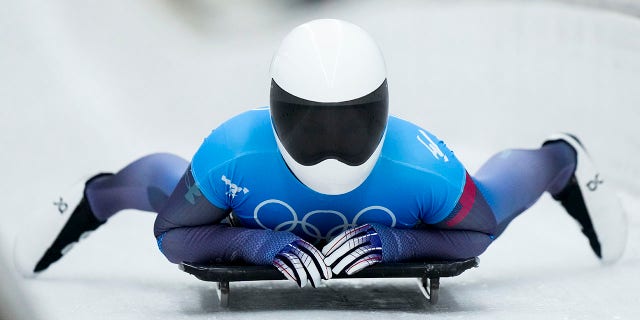 Kelly Curtis, of United States, finishes the women's skeleton run 2 at the 2022 Winter Olympics, Friday, Feb. 11, 2022, in the Yanqing district of Beijing.