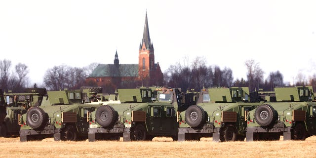 U.S. troops of the 82nd Airborne Division, deployed to Poland because of the Russia-Ukraine tensions, set up camp at a military airport in Mielec, southeastern Poland, on Feb. 12, 2022. (AP Photo/Beata Zawrzel)