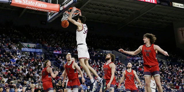 Gonzaga center Chet Holmgren (34) dunks during the second half of the team's NCAA college basketball game against Saint Mary's, Saturday, Feb. 12, 2022, in Spokane, Wash. Gonzaga won 74-58.