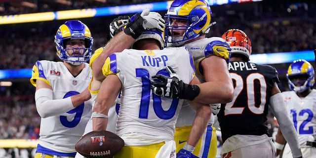 Los Angeles Rams wide receiver Cooper Kupp (10) is congratulated by teammates after scoring a touchdown against the Cincinnati Bengals during the second half of the NFL Super Bowl 56 football game Sunday, Feb. 13, 2022, in Inglewood, Calif.