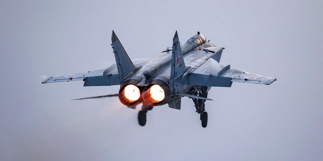 In this photo provided by the Russian Defense Ministry Press Service on Monday, Feb. 14, 2022. A MiG-31 fighter of the Russian air force takes off at an air base during military drills in Tver region, Russia. 