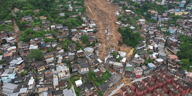 An aerial view shows a neighborhood affected by landslides in Petropolis, Brazil, Wednesday, Feb. 16, 2022.