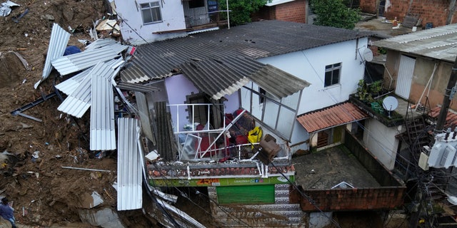 Damaged residences are seen after a landslide in Petropolis, Brazil, Wednesday, Feb. 16, 2022.