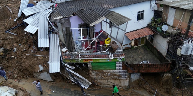 Damaged residences are seen after a landslide in Petropolis, Brazil, Wednesday, Feb. 16, 2022.