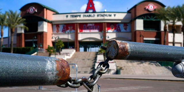 The main parking lot at the Los Angeles Angels Tempe Diablo Stadium remains closed as pitchers and catchers are not starting spring training workouts as scheduled as the Major League Baseball lockout enters its 77th day and will prevent pitchers and catchers from taking the field for the first time since October in Tempe, Ariz., Wednesday, Feb. 16, 2022. (WHD Photo/Ross D. Franklin)