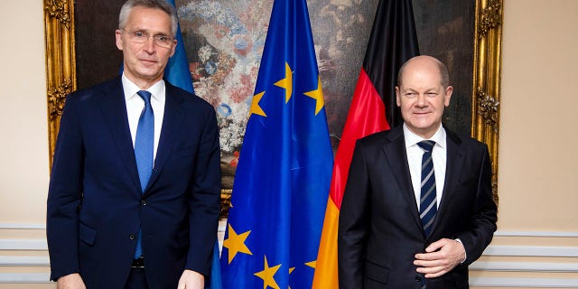 German Chancellor Olaf Scholz (right) and NATO Secretary General Jens Stoltenberg meet for bilateral talks at the Munich Security Conference in Munich, Germany, on Saturday, February 19, 2022.