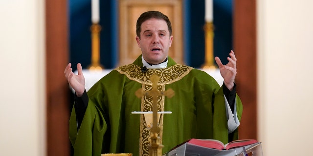Father Matthew Hood celebrates mass at Our Lady of the Rosary church Friday, Feb. 18, 2022, in Detroit. (WHD Photo/Paul Sancya)