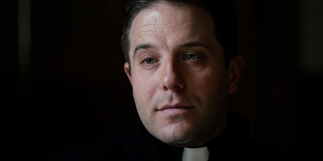 Father Matthew Hood is shown at Our Lady of the Rosary church Friday, Feb. 18, 2022, in Detroit. (AP Photo/Paul Sancya)