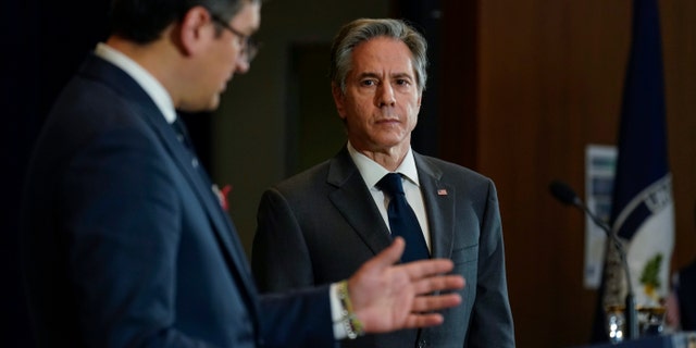 Secretary of State Antony Blinken, right, looks to Ukraine's Foreign Minister Dmytro Kuleba as he speaks during a news conference at the State Department in Washington, Tuesday, Feb. 22, 2022. (WHD Photo/Carolyn Kaster, Pool)