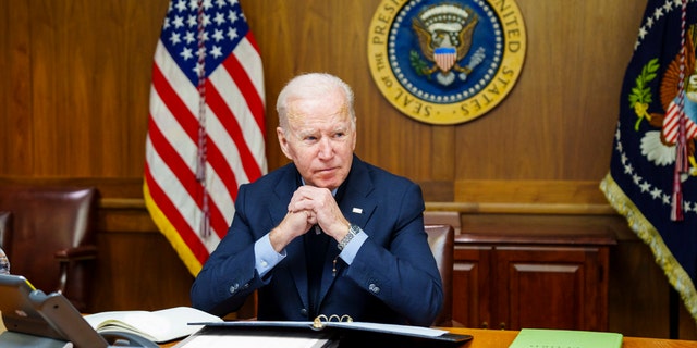 FILE = This image provided by The White House via Twitter shows President Joe Biden at Camp David, Md., Feb. 12, 2022. A new poll finds little support among Americans for a major U.S. role in the Russia-Ukraine conflict. President Joe Biden has acknowledged the growing likelihood of a new war in Eastern Europe will affect Americans even if U.S. troops don’t deploy to Ukraine. Just 26% of Americans say the U.S. should have a major role in the conflict between Russia and Ukraine, according to a new poll from The Associated Press-NORC Center for Public Affairs Research.