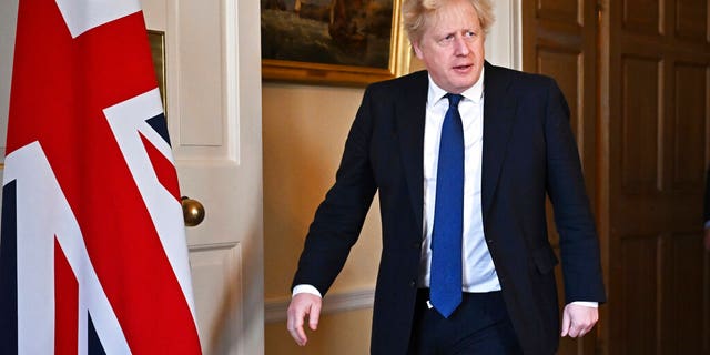 Britain's Prime Minister Boris Johnson arrives to deliver an address on the attack by Russia on Ukraine