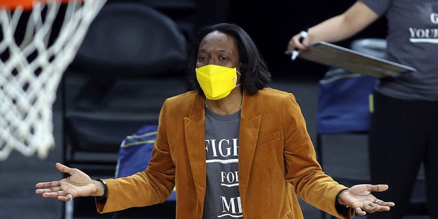 FILE - California head coach Charmin Smith talks with an official during an NCAA college basketball game in the first round of the Pac-12 women's tournament Wednesday, March 3, 2021, in Las Vegas. California women's basketball coach Charmin Smith and her players figured they had gone through the worst of the pandemic in 2020-21.
