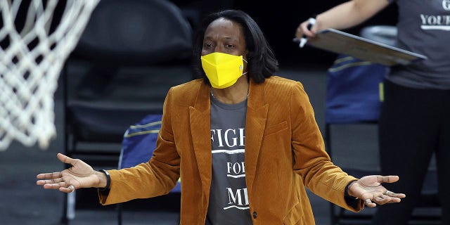 FILE - California head coach Charmin Smith talks with an official during an NCAA college basketball game in the first round of the Pac-12 women's tournament Wednesday, March 3, 2021, in Las Vegas. California women's basketball coach Charmin Smith and her players figured they had gone through the worst of the pandemic in 2020-21.
