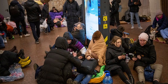 People rest in the Kyiv subway, using it as a bomb shelter in Kyiv, Ukraine, Thursday, Feb. 24, 2022. Russia has launched a full-scale invasion of Ukraine, unleashing airstrikes on cities and military bases and sending troops and tanks from multiple directions in a move that could rewrite the world's geopolitical landscape. (WHD Photo/Emilio Morenatti)