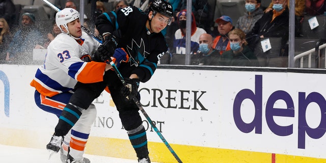 New York Islanders defenseman Zdeno Chara (33) defends against against San Jose Sharks right wing Timo Meier (28) during the first period of an NHL hockey game in San Jose, Calif., Thursday, Feb. 24, 2022.