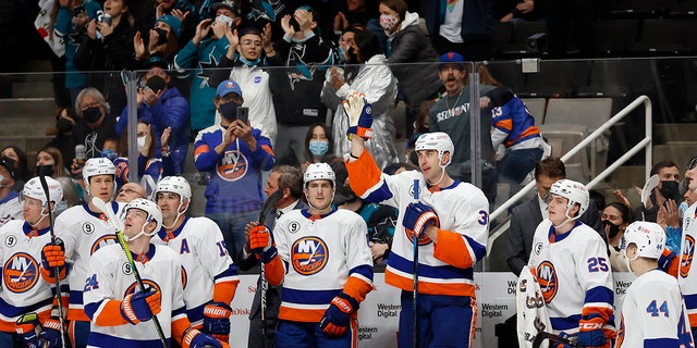 New York Islanders defenseman Zdeno Chara waves to the crowd as he is acknowledged for breaking Chris Chelios' league record for games played by a defenseman, during the first period of the team's NHL hockey game against San Jose Sharks in San Jose, Calif., Thursday, Feb. 24, 2022. 