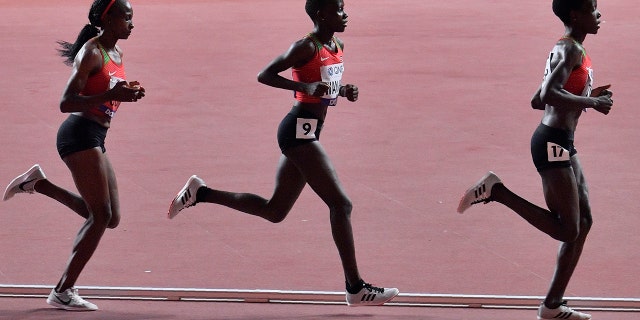 Hellen Obiri, Rosemary Monica Wanjiru and Agnes Tirop, from left to right, all of Kenya, compete in the women's 10,000 meters during the World Athletics Championships in Doha, Qatar on Sept. 28, 2019.
