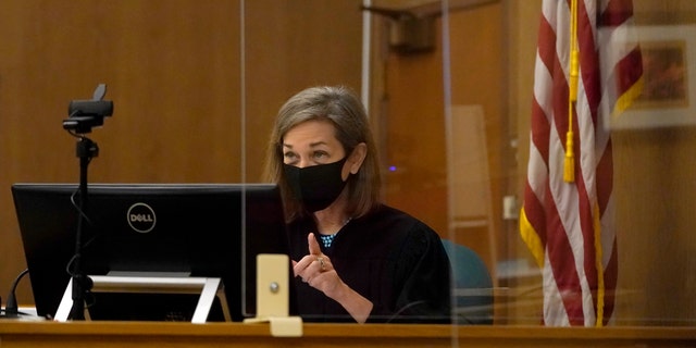 Judge Anne-Christine Massullo gestures toward attorneys during a hearing at the San Mateo County Superior Court in Redwood City, Calif., Feb. 25, 2022. 