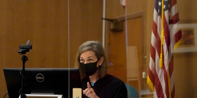 Judge Anne-Christine Massullo gestures toward attorneys during a hearing at the San Mateo County Superior Court in Redwood City, Calif., Feb. 25, 2022. 