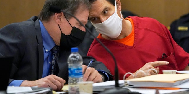 Scott Peterson, right, talks with attorney Cliff Gardner during a hearing at the San Mateo County Superior Court in Redwood City, Calif., Friday, Feb. 25, 2022. 