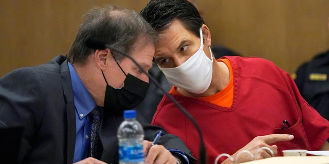 Scott Peterson, right, talks with attorney Cliff Gardner during a hearing at the San Mateo County Superior Court in Redwood City, Calif., Friday, Feb. 25, 2022. 