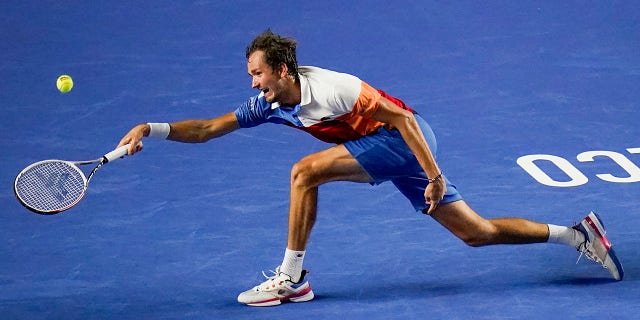 Russia's Daniil Medvedev hits a return to Spain's Rafael Nadal at the Mexican Open in Acapulco, Friday, Feb. 25, 2022.