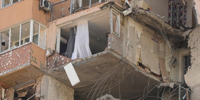 Apartment building damaged by rocket fire in Kyiv, Ukraine, on Saturday, February 26, 2022. Russian troops stormed the Ukrainian capital on Saturday, and street fighting broke out when city officials urged residents to hide. (AP Photo / Jafrem Lukacki)