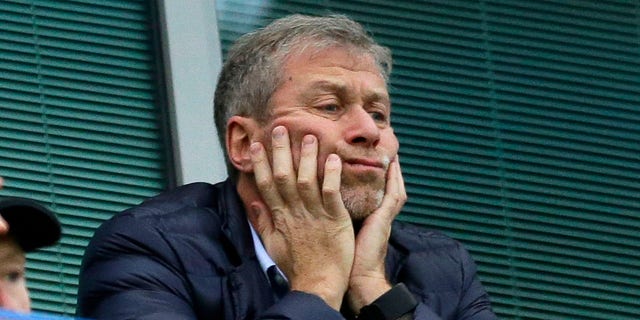 FILE - Chelsea soccer club owner Roman Abramovich sits in his box before their English Premier League soccer match against Sunderland at Stamford Bridge stadium in London, Dec. 19, 2015. Chelsea owner Roman Abramovich has on Saturday, Feb. 26, 2022 suddenly handed over the 