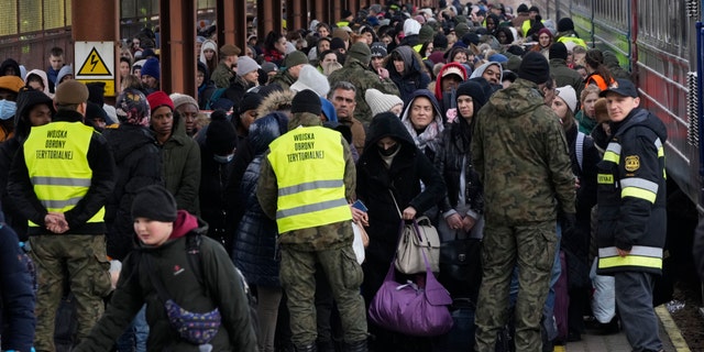 Refugees from Ukraine arrive to the railway station in Przemysl, Poland, Sunday, Feb. 27, 2022. (AP Photo/Czarek Sokolowski)