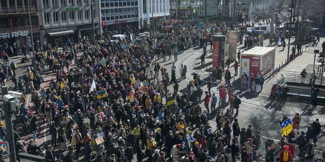 Tens of thousands demonstrate in Cologne, Germany, during a peace march against the war in Ukraine on Shrove Monday, Feb. 28, 2022. (AP Photo/Martin Meissner)