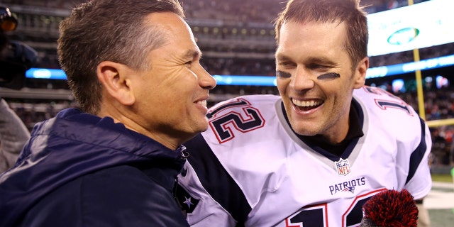 Tom Brady of the New England Patriots celebrates with trainer Alex Guerrero after defeating the New York Jets, 22-17, at MetLife Stadium on Nov. 27, 2016, in East Rutherford, New Jersey.
