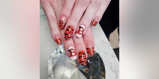 Ahead of her wedding day on Feb. 13, 2022, Rachel Hyden showed off her black-and-orange fingernails — Bengals-themed, of course.