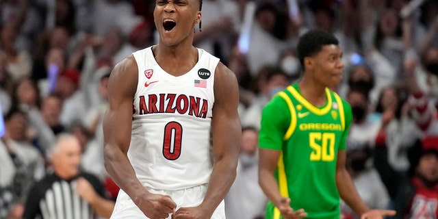 Arizona guard Bennedict Mathurin (0) reacts after scoring against Oregon during the first half of an NCAA college basketball game, Saturday, Feb. 19, 2022, in Tucson, Ariz. 