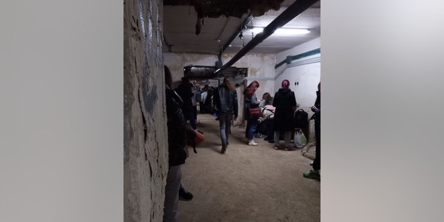 One of Manoff's students sent this image to her: A group of Ukrainians are shown taking safety in a bomb shelter outside Kyiv as the Russians attack their country. 