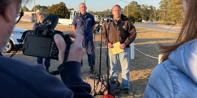 Carteret County Sheriff Asa Buck gives an update Monday on a plane crash in North Carolina. He said one body had been recovered and it appeared none of the eight people abroad the aircraft have survived. 