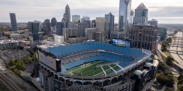 An aerial view of Bank of America Stadium and the downtown Charlotte skyline.